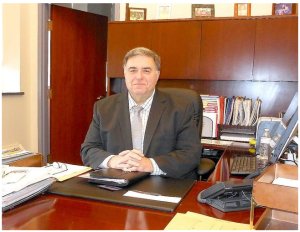 Little Falls City School District Superintendent Louis Patrei sits at his desk in his office Tuesday. Last week, Patrei announced he will be retiring from his position to spend more time with family. Telegram Photo/Stephanie Sorrell-White